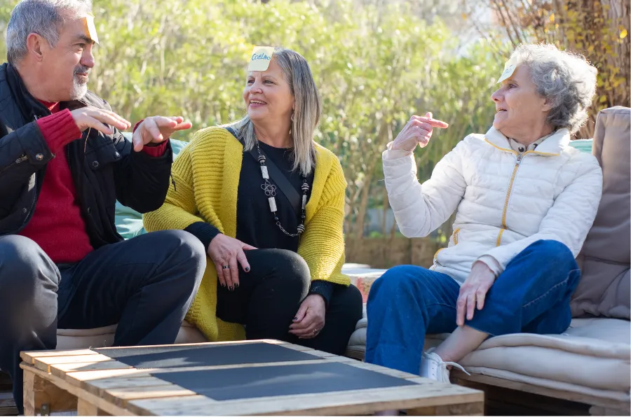 Elderly group playing a table game