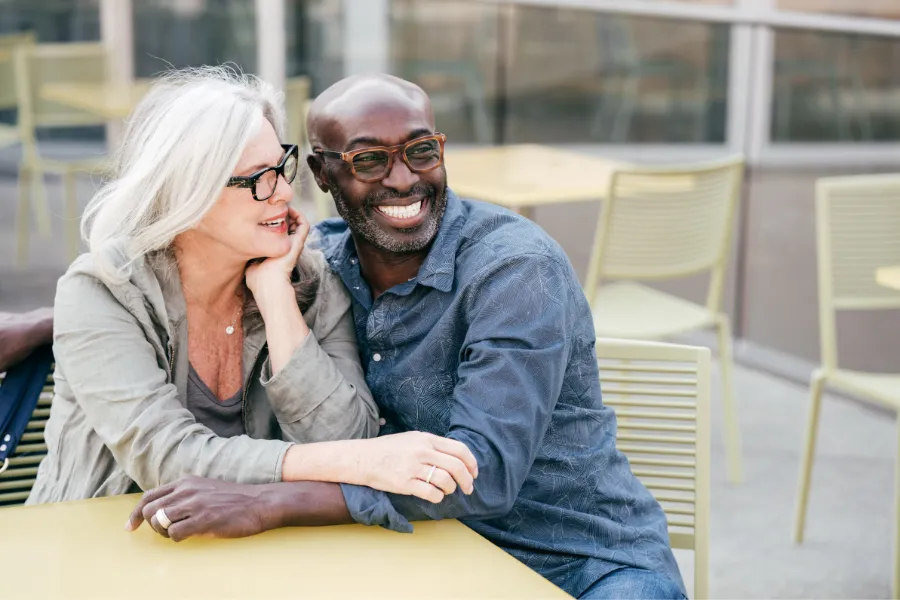 Elderly couple sitting outdoors
